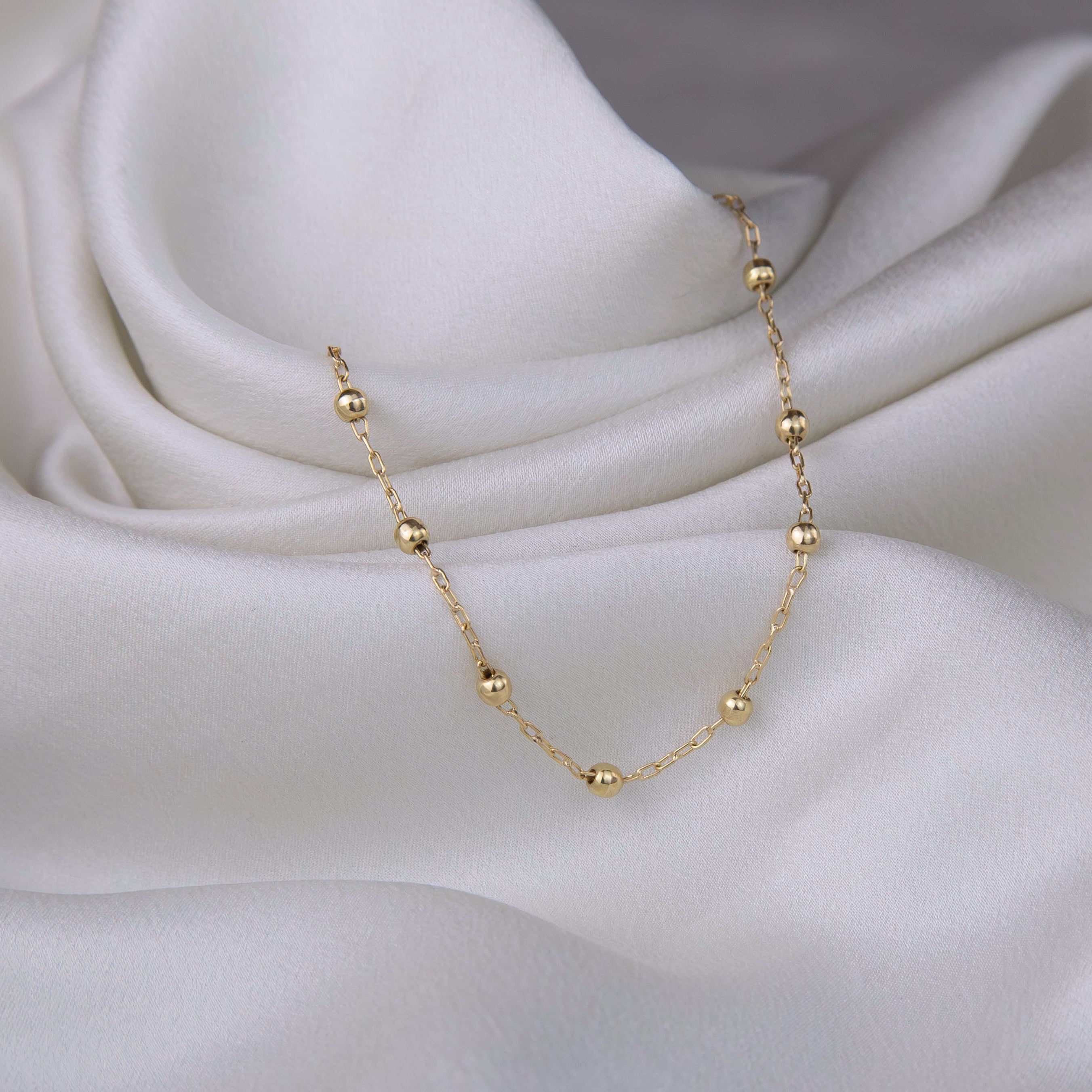 Pulsera de bolitas de oro